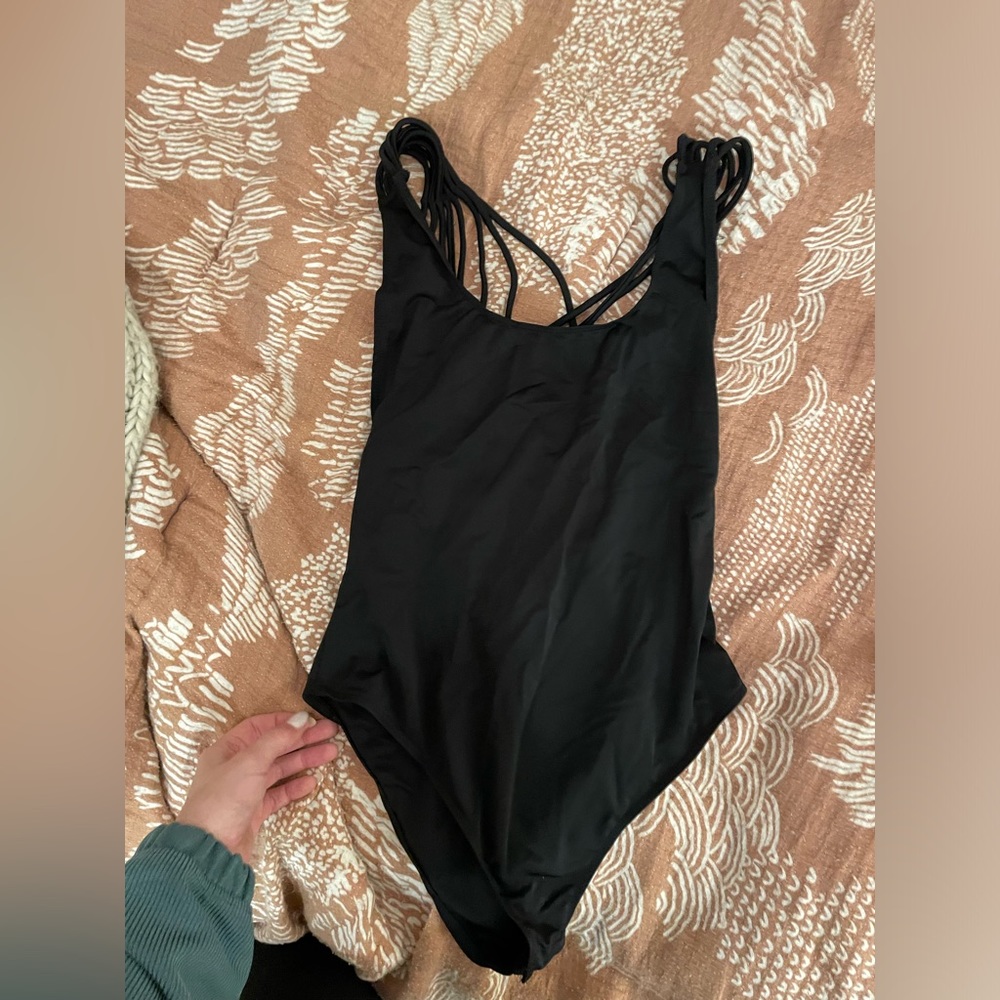 Vestique body suit open back design